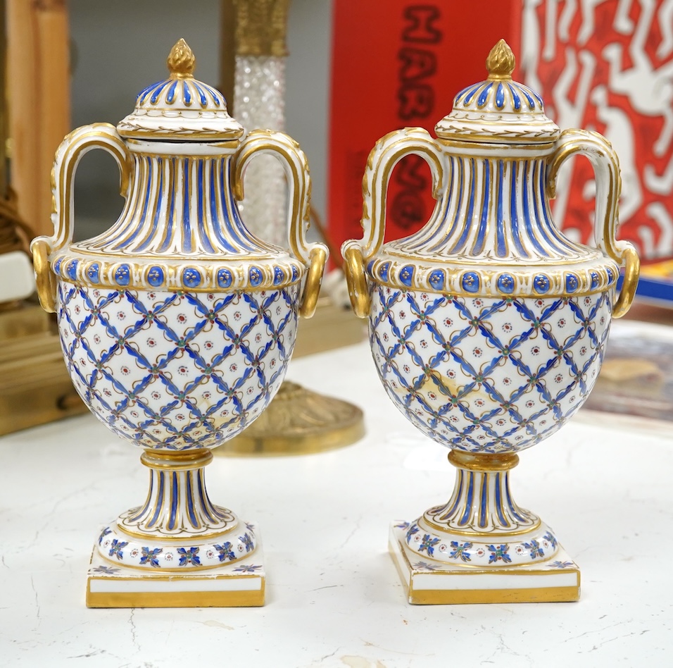 A pair of early 20th century Sevres style vases and covers, 21cm. Condition - good